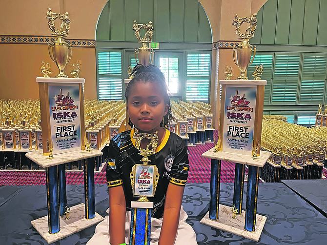 Three golds for seven-year-old martial arts champion Amber